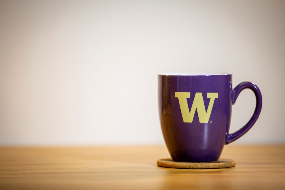 UW mug on wooden tabletop